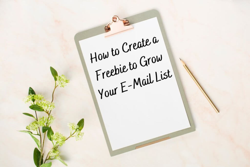 Clipboard-on-Pink-Background-Text-How-To-Create-a-Freebie-to-Grow-Your-E-mail-List